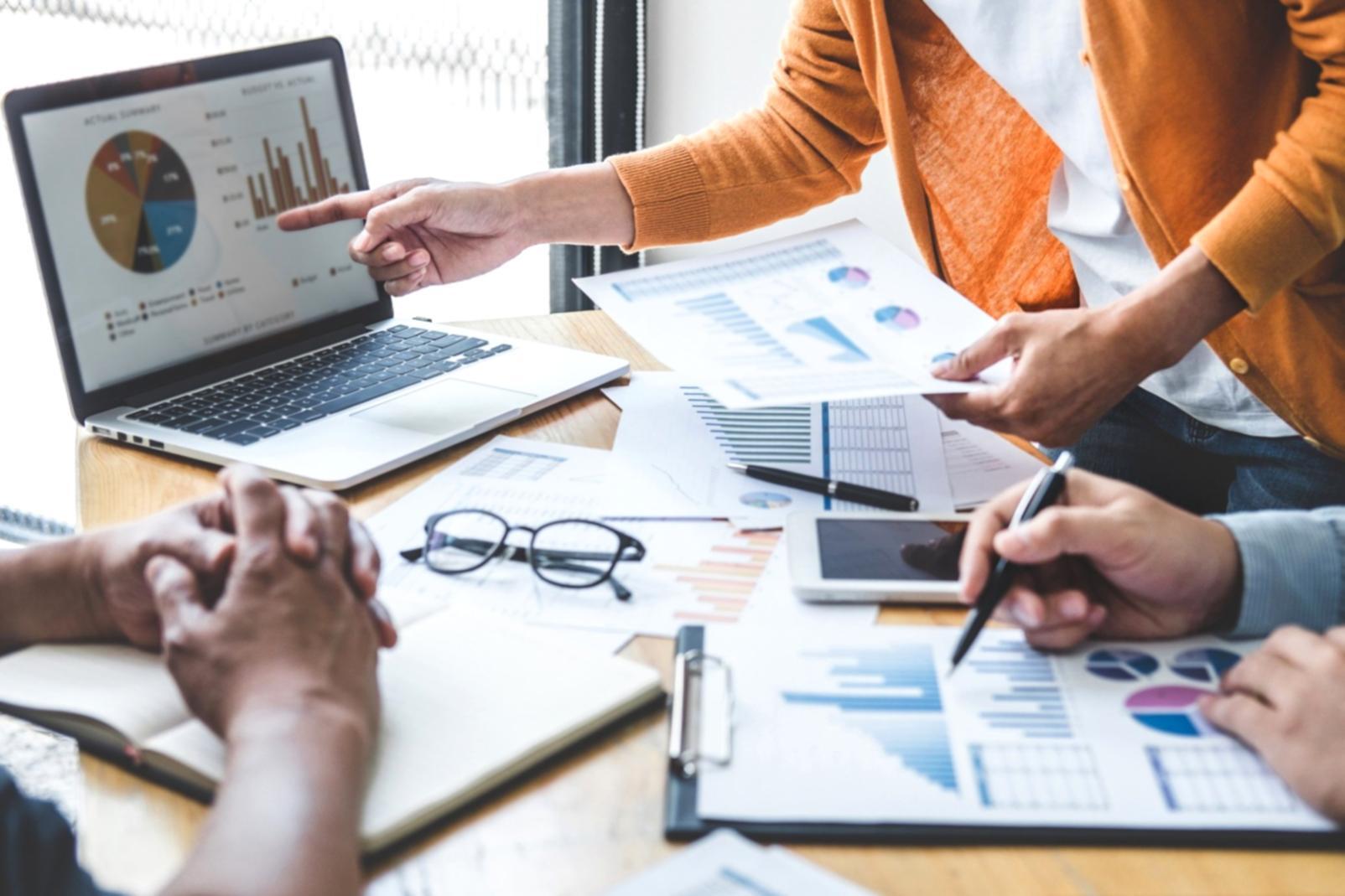 Students engaging with investment concepts through interactive learning